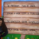 Aluna premiada com a exposição de sua poesia no muro externo do Colégio.